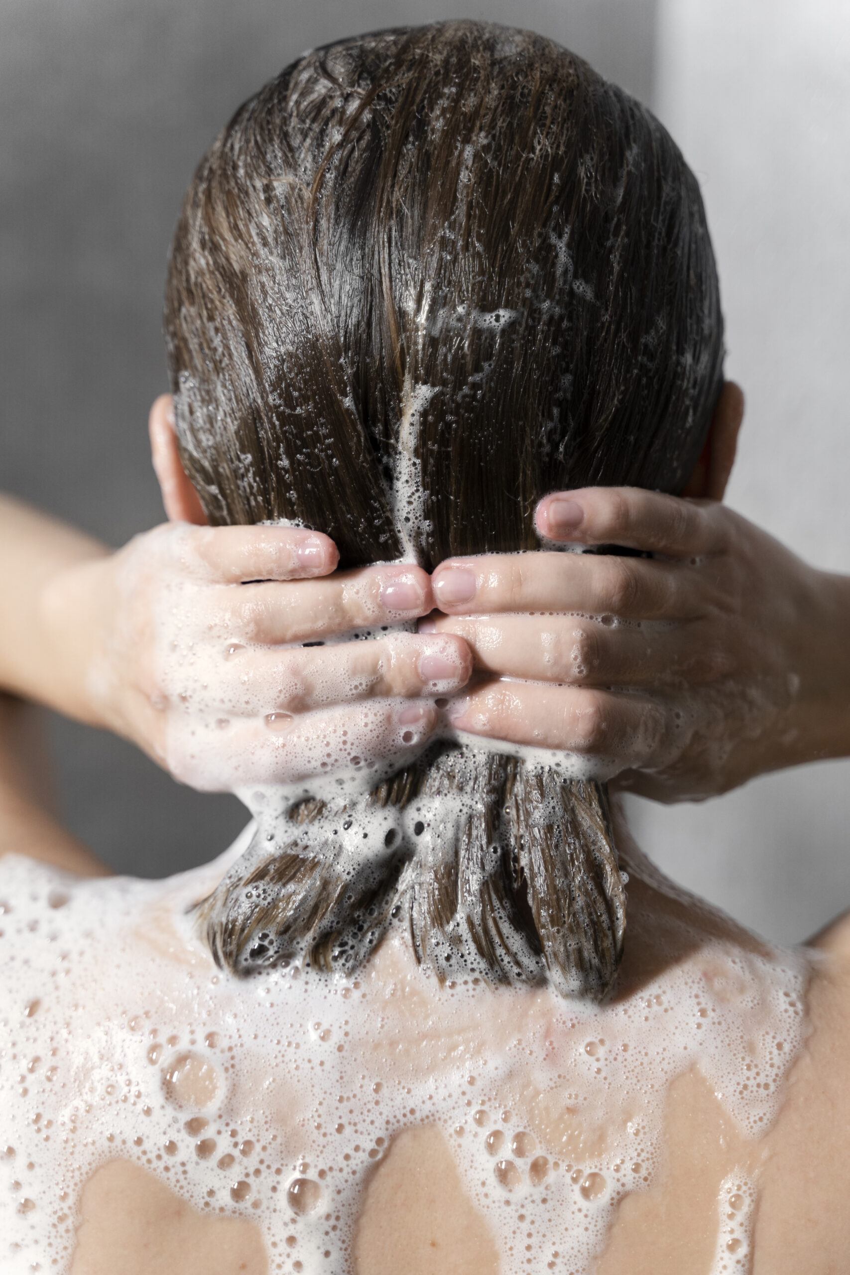 young-woman-applying-anti-dandruff-product (2)